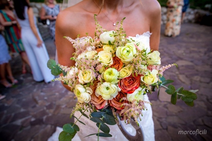 Bridal bouquet of vintage and white roses, white rannunculous and blush astilibe in Taormina