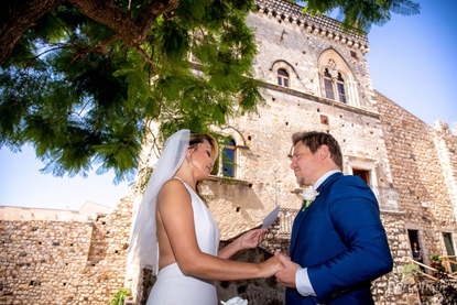 Exchanging wedding promises in the Palazzo Duchi di Santo Stefano garden in Taormina