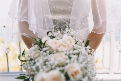 Bridal wedding portrait details with veil and pretty bouquet in Taormina