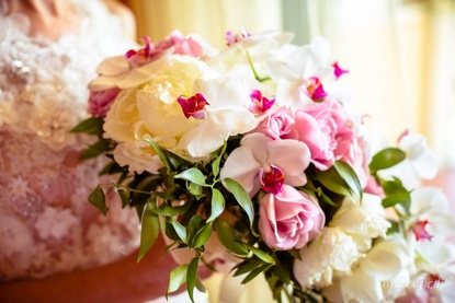 Gorgeous pastel bridal bouquet of phalaenopsis orchids, peonies and roses in Taormina