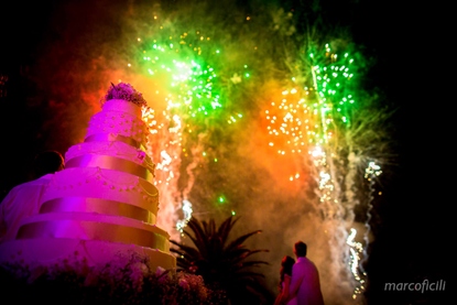 Colourful fireworks with the wedding cake shoot high into the sky at Belmond Grand Hotel Timeo Taormina