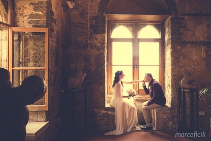 Suggestive photography in the medieval Palazzo Duchi di Santo Stefano Taormina wedding hall