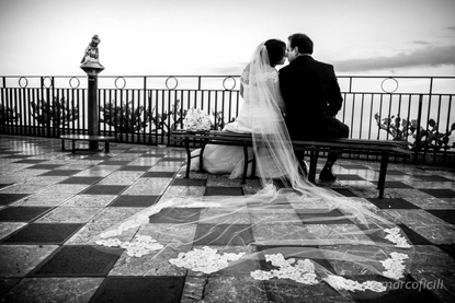 Bride and Groom share a private moment at sunset in Piazza IX Aprile Taormina Corso Umberto