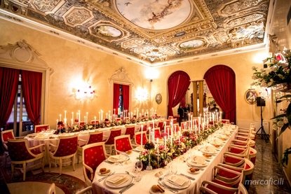 Imperial tables with luxurious fruit, floral and silver candlestick decor at Salone delle Feste Ristorante Baronessa Taormina