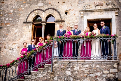 Bridal party photo on the stone steps of the Palazzo Duchi di Santo Stefano in Taormina